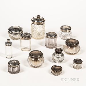 Twelve Sterling Silver and Silver-plated Mounted Cut, Pressed, and Molded Dresser Jars