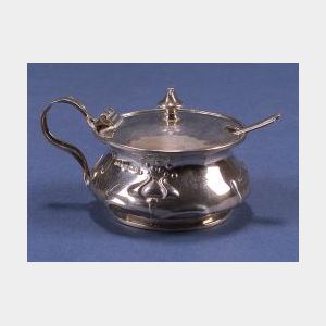 George V Arts & Crafts Style Sterling Silver Mustard Pot and a Salt Spoon.