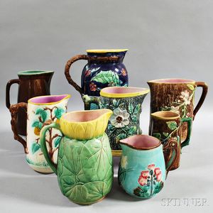 Eight Majolica Pottery Pitchers