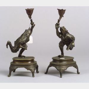 Pair of Asian Bronze Figural Bronze Candlesticks