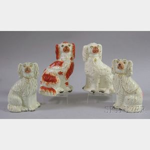 Four Staffordshire Seated Spaniels