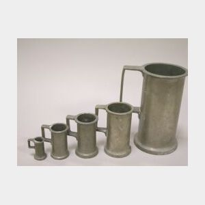 Five French Pewter Graduated Mugs.