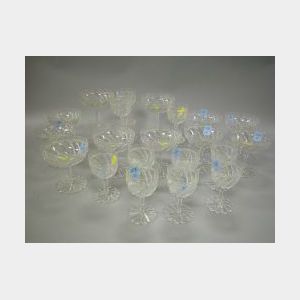 Set of Twenty-one Colorless Cut Glass Champagne and Wine Stems.