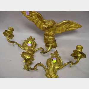 Small Carved Giltwood Eagle and a Pair of Rococo-style Gilt Cast Brass Two-Arm Wall Sconces.