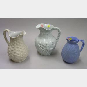 Three English Glazed Molded Stoneware Pitchers