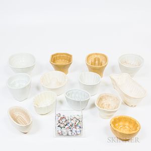 Collection of Pottery Molds and a Group of Decorated Ceramic Marbles