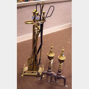 Set of Federal-style Brass Urn Finial Andirons, a Three-Piece Brass Tool and Stand Set, Iron Tongs, and a Poker.