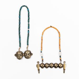 Two Naga Brass Chest Ornaments
