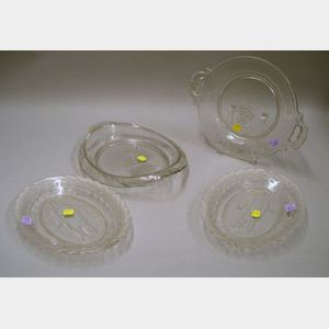 Four Colorless Pressed Pattern Glass Bread Plates.