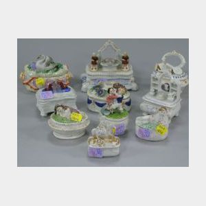 Ten Porcelain Figural Trinket Boxes.