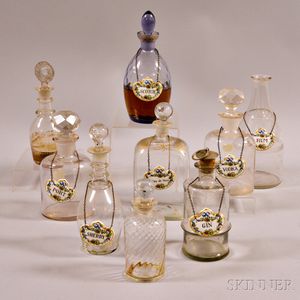 Nine Blown Glass Decanters and Six Porcelain Liquor Labels. 