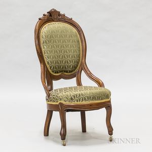 Renaissance Revival Carved and Upholstered Walnut Chair. 