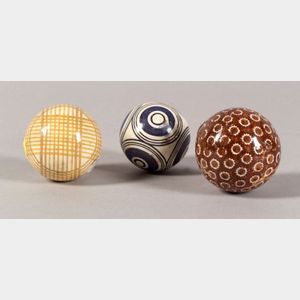 Collection of Fifteen Glazed Pottery Carpet Balls