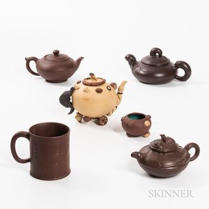 Six Yixing Ware Pottery Teapots and a Cup. 
