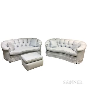 Pair of Blue Tufted Sofas and an Ottoman. 