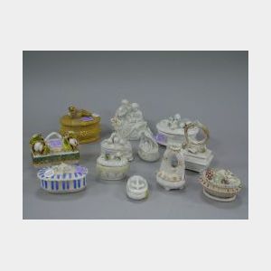 Twelve Porcelain Figural Trinket Boxes.
