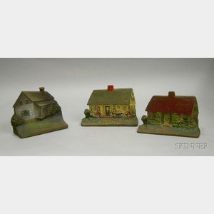 Two Painted Cast Iron Cottage Doorstops and a Bradley & Hubbard Painted Cast Iron House Doorstop.
