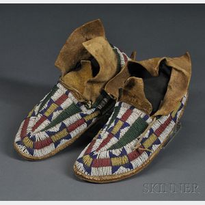 Pair of Cheyenne Youth's Beaded Buffalo Hide Moccasins