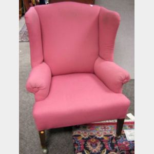 Upholstered Mahogany Wing Chair.