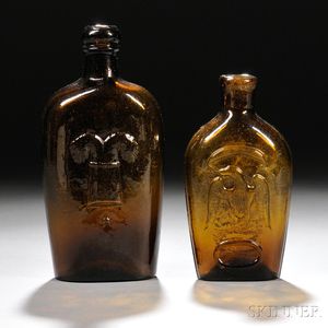 Two Amber Blown-molded Pictorial Glass Flasks