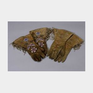 Two Pairs of Decorated Hide Gauntlets