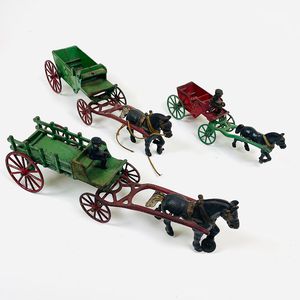Three Painted Cast Iron Horse-drawn Carts