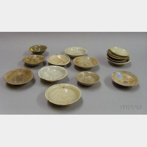 Approximately Fifteen Slip and Celadon Glazed Saucer Dishes.