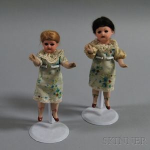 Two Small German All-bisque Socket-head Girl Dolls
