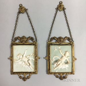 Pair of Brass-mounted Relief-molded Ceramic Plaques with Putti