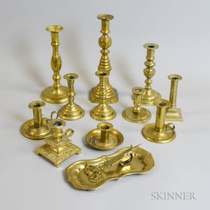 Eleven Brass Candlesticks, a Pair of Wick Cutters, and a Tray