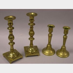 Two Pairs of Brass Candlesticks.