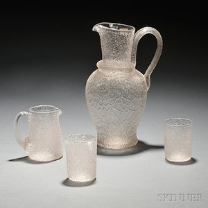 Four Overshot Colorless Glass Objects