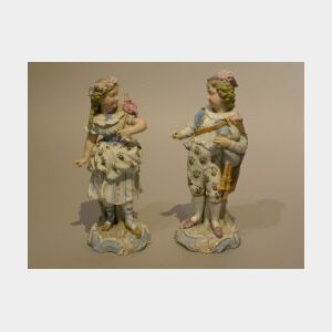 Pair of German Bisque Figures of a Boy and Girl.