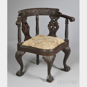 Late Victorian Carved Mahogany North Wind Roundabout Chair with Ball-and-claw Feet