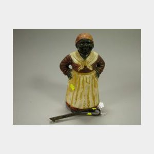 Painted Cast Iron Mammy Doorstop and Implement.