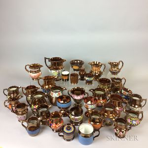 Thirty-six Pieces of Copper Lustre Ceramic Tableware. 