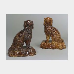 Two Rockingham-type Earthenware Spaniel Figures.