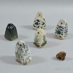 Five Ceramic Weights and a Wood Carving