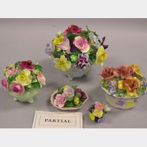 Nine Porcelain and Ceramic Floral Basket Figural Groups.