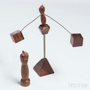 Two Carved Rosewood and Brass Hand Sculptures