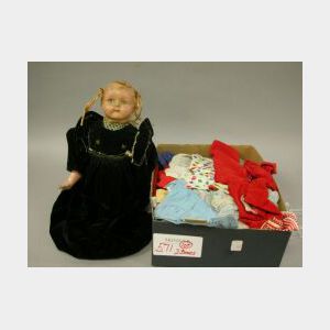 Doll and Lot of Doll Clothes.