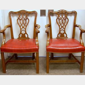 Pair of Chippendale-style Red Leather Upholstered Carved Cherry Armchairs.