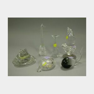 Seven Colorless Glass Animal Figures and a Sculpture.