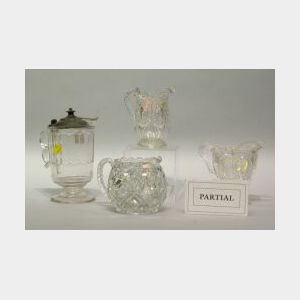 Twenty-one Assorted Colorless Pressed Pattern Glass Creamers and Tankards.