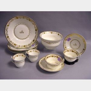 Sixty-Piece English Gilt Decorated Porcelain Partial Tea Service.