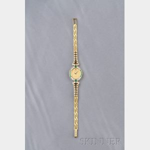 Lady's 18kt Gold, Emerald, and Diamond Wristwatch, Baume & Mercier