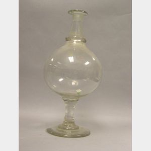 Colorless Blown Glass Footed Globe.