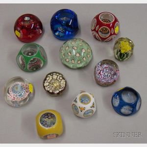 Twelve Faceted Internally Decorated Paperweights