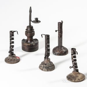Four Iron and Wood Spiral Candlesticks and a Rushlight