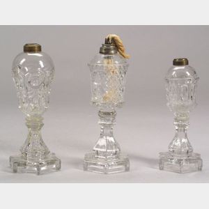 Three Colorless Pressed Glass Fluid Lamps